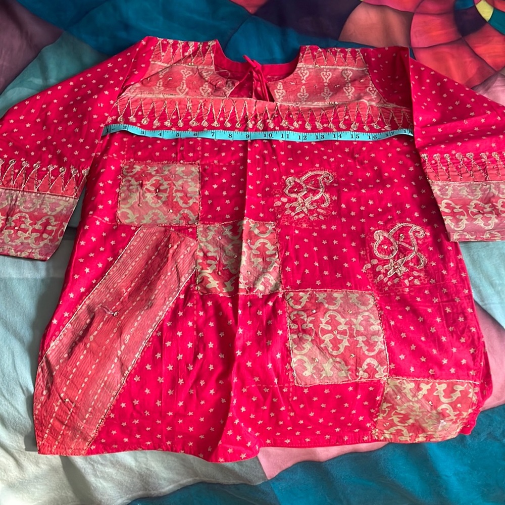 It’s beautifully Indian short kurta tunic top. It’s little small for me.